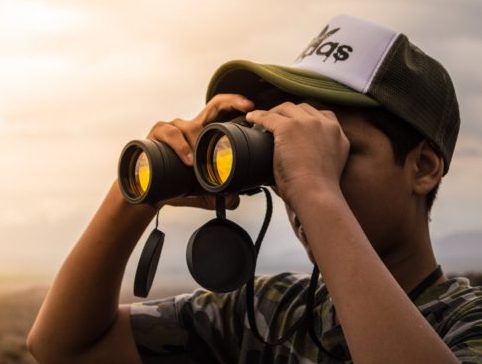Image of man with binoculars